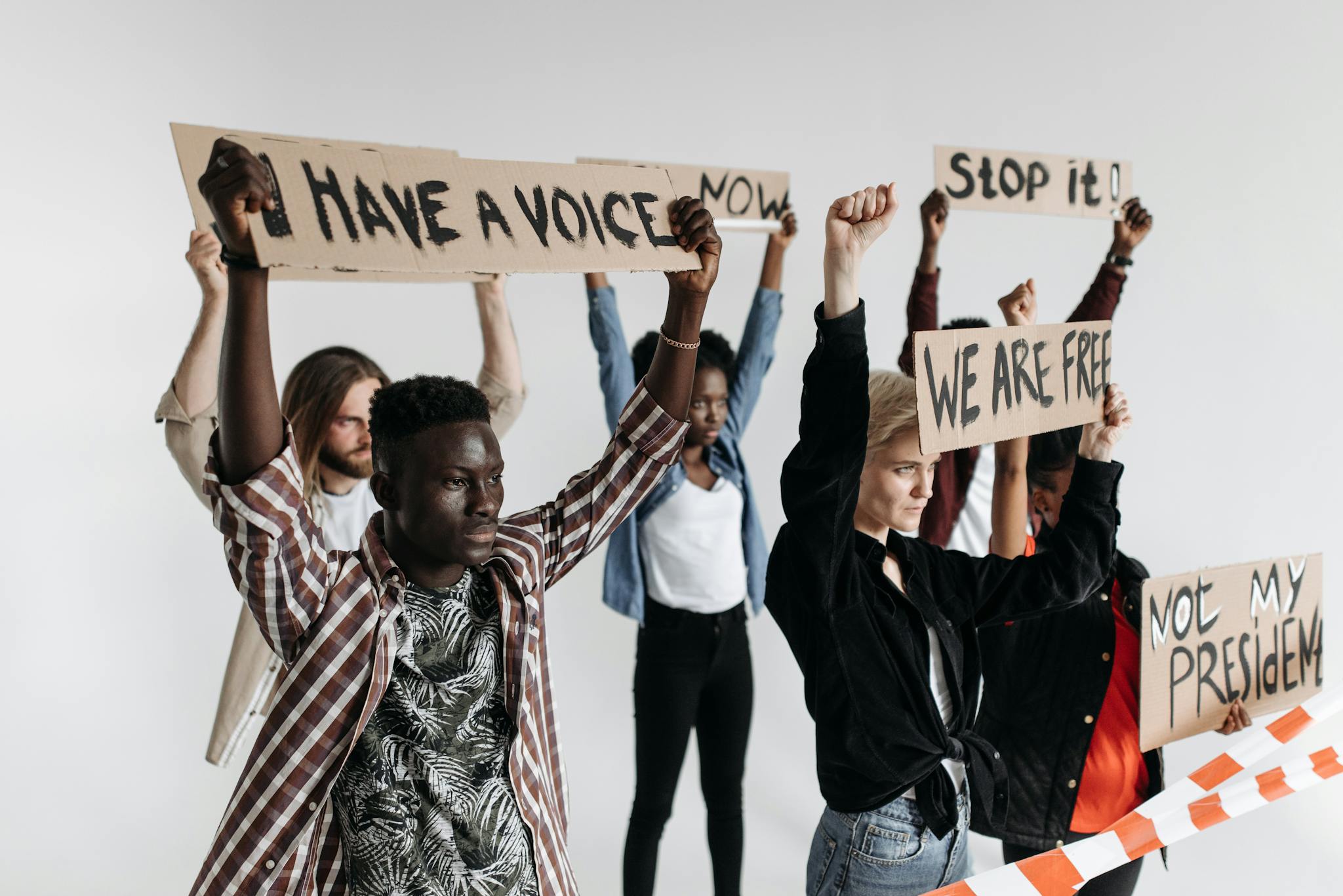 Protesters holding placards advocating freedom and equality.